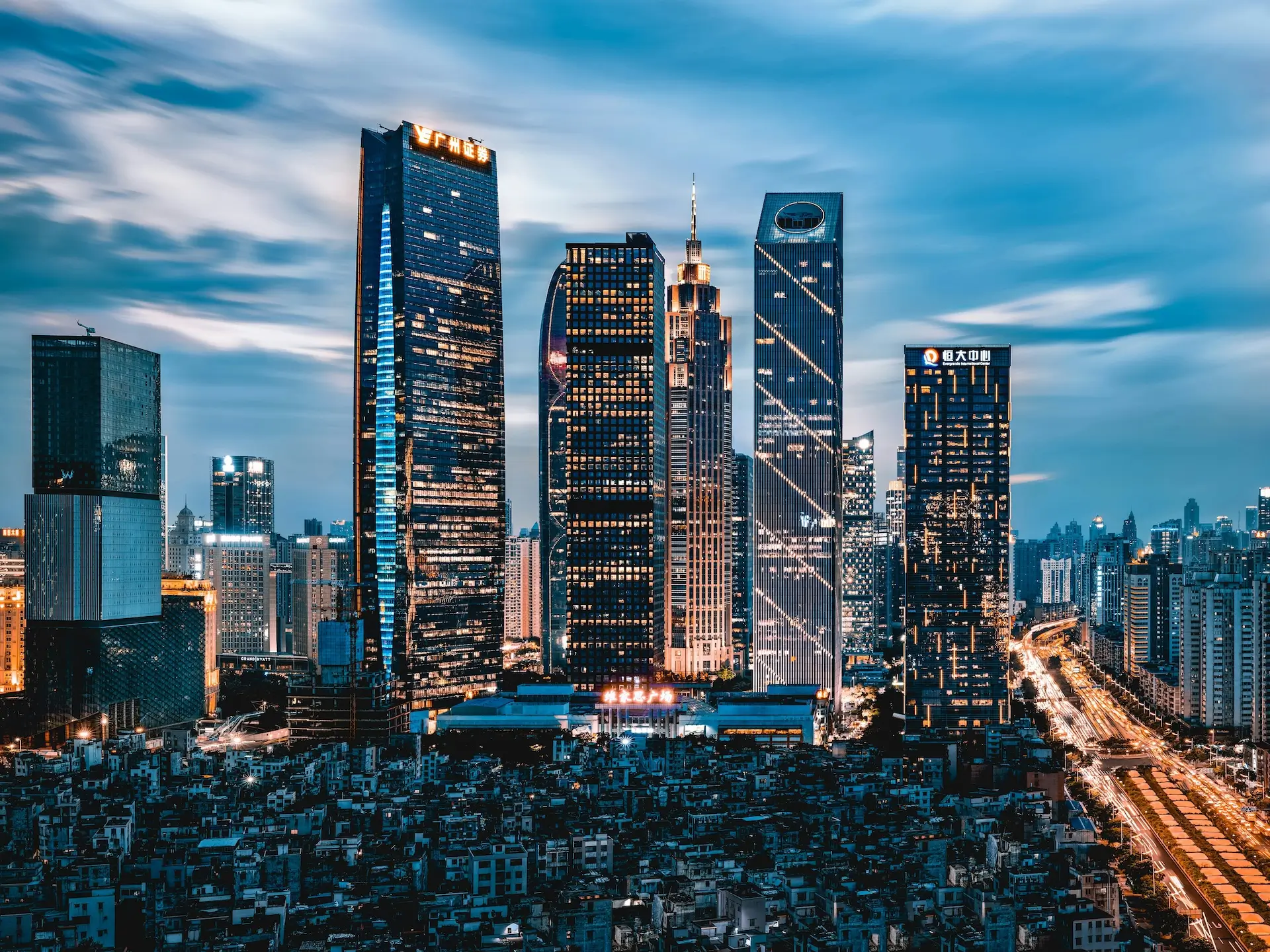 Professional business team working in modern office with Shanghai cityscape background - China Business Solutions